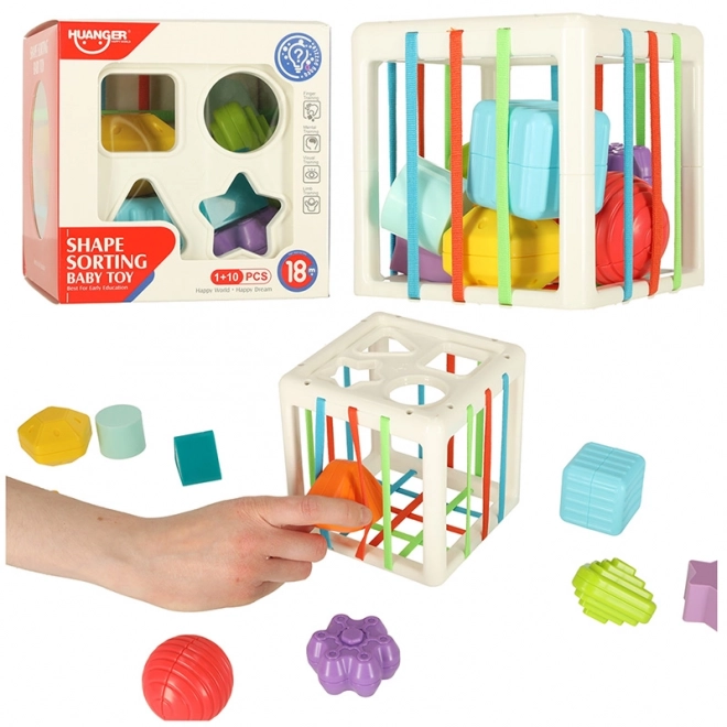Cube sensoriel flexible avec blocs puzzle carrés et trieur de formes
