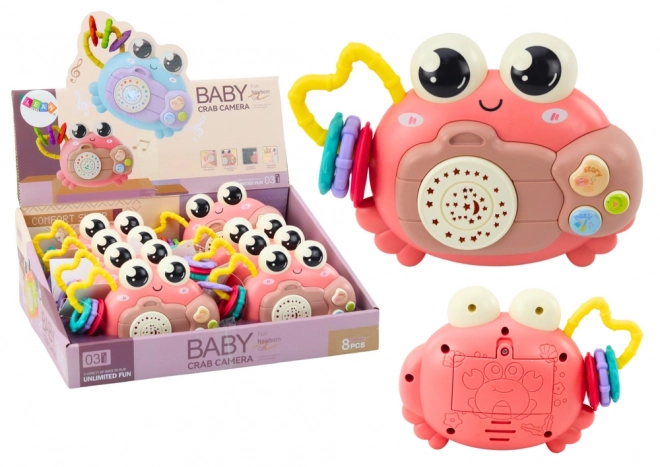 Crabe interactif rose avec projecteur et hochet à piles