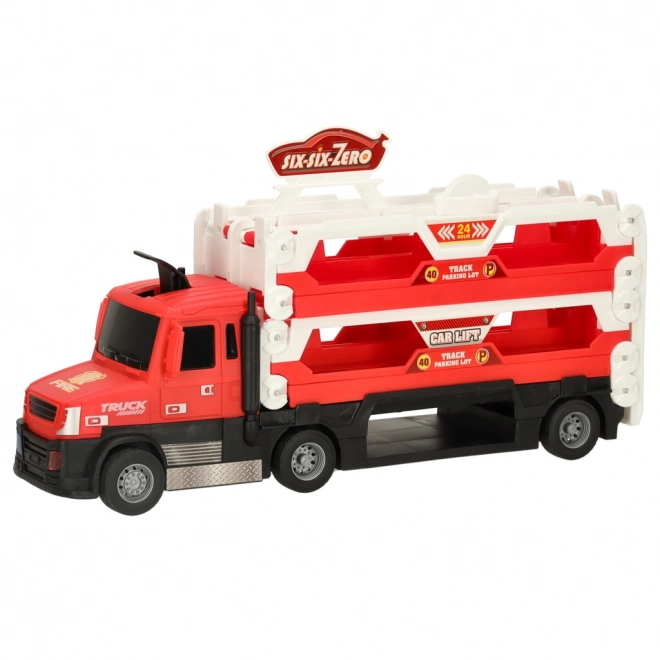 Camion rouge avec circuit caché et 6 petites voitures