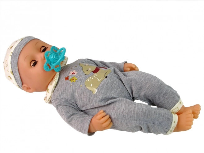 Poupon Poupée en Pyjama Gris avec Sons et Accessoires