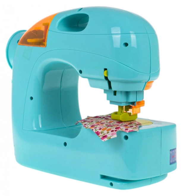 Machine à coudre bleue + accessoires