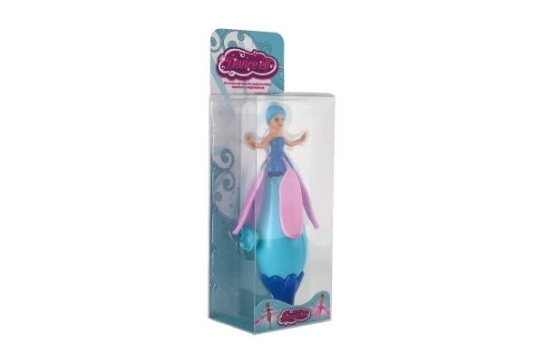 Poupée fée à ressort en plastique 17 cm dans une boîte 8x24x6cm