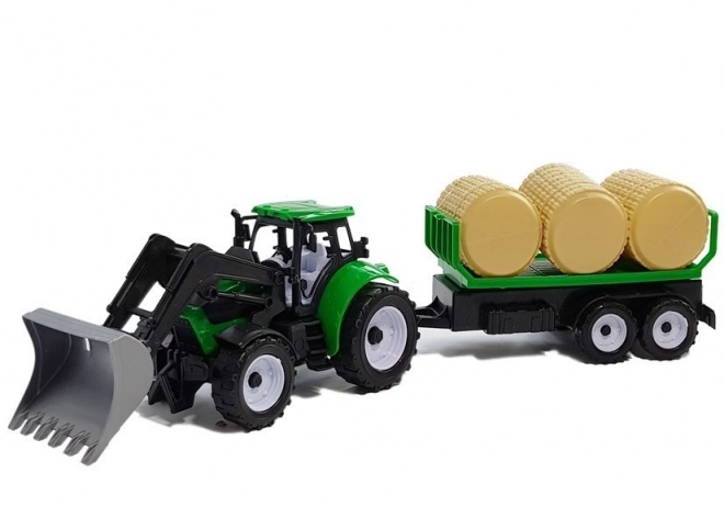 Tracteur avec remorque pour bottes de foin Citerne
