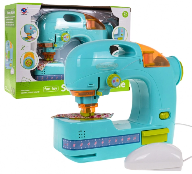 Machine à coudre bleue + accessoires