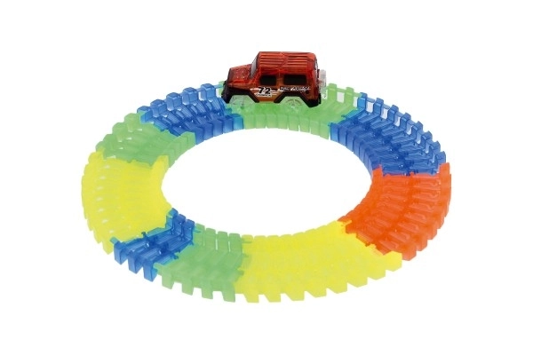 Circuit lumineux dans le noir + voiture à piles en plastique 57 pièces longueur 72cm sur carte 17x24x7cm