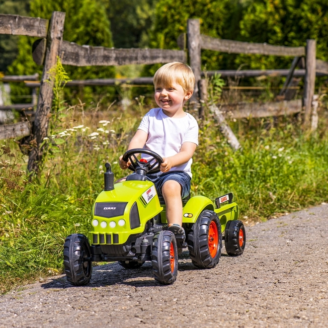 Tracteur à pédales Claas Arion 410 avec remorque