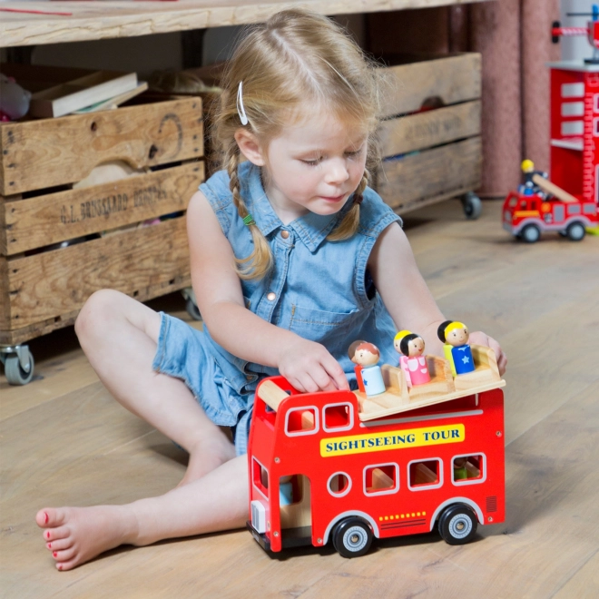 Autobus urbain rouge avec figurines