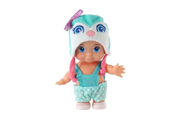 Poupée/bébé avec bonnet, plastique corps rigide 15cm, 4 types dans boîte 9x16x6cm