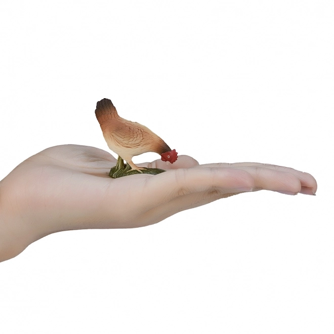 Figurine réaliste poule se nourrissant
