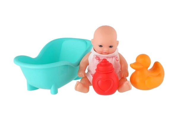 Poupée avec baignoire et accessoires