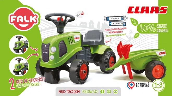 Tracteur pousseur Claas vert avec volant et remorque