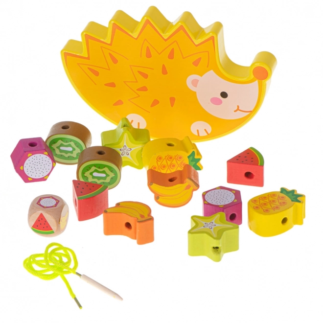 Jeu de laçage en bois avec hérisson et fruits