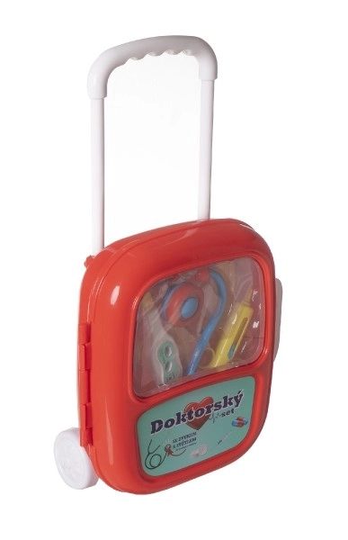 Ensemble de docteur avec stéthoscope dans une valise à roulettes