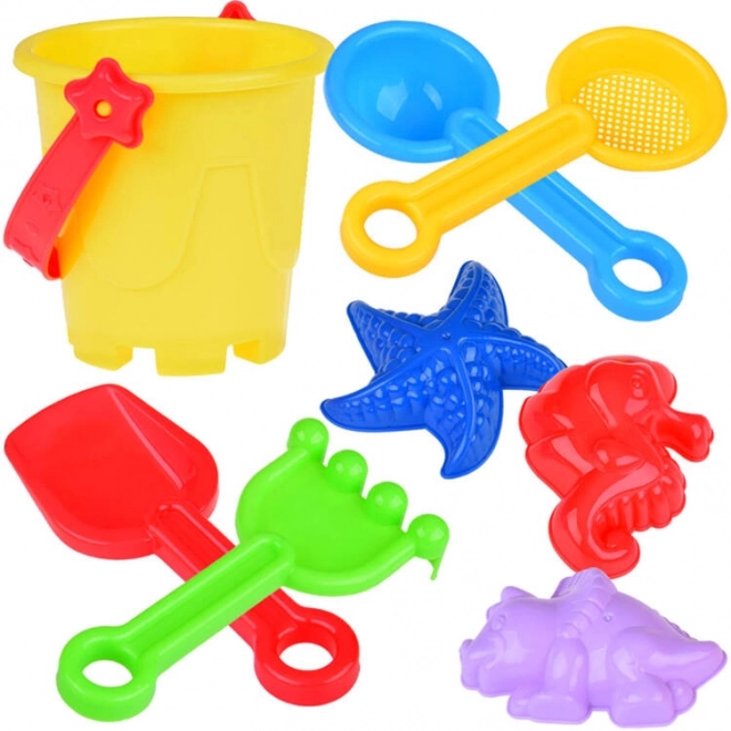 Ensemble coloré de jouets de sable avec seau et moules