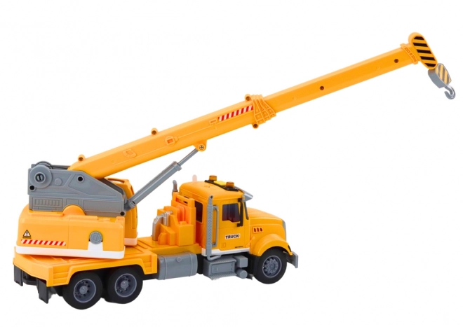 Grue de chargement jaune avec entraînement à friction et effets lumineux et sonores
