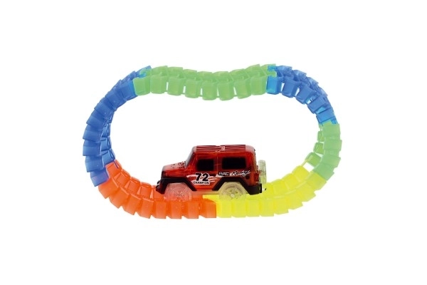 Circuit lumineux dans le noir + voiture à piles en plastique 57 pièces longueur 72cm sur carte 17x24x7cm