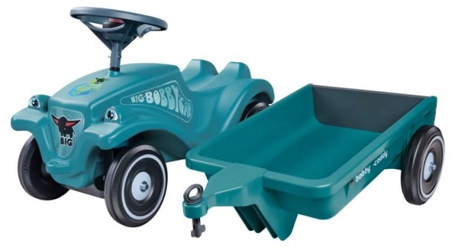 Voiture à pousser avec remorque en turquoise