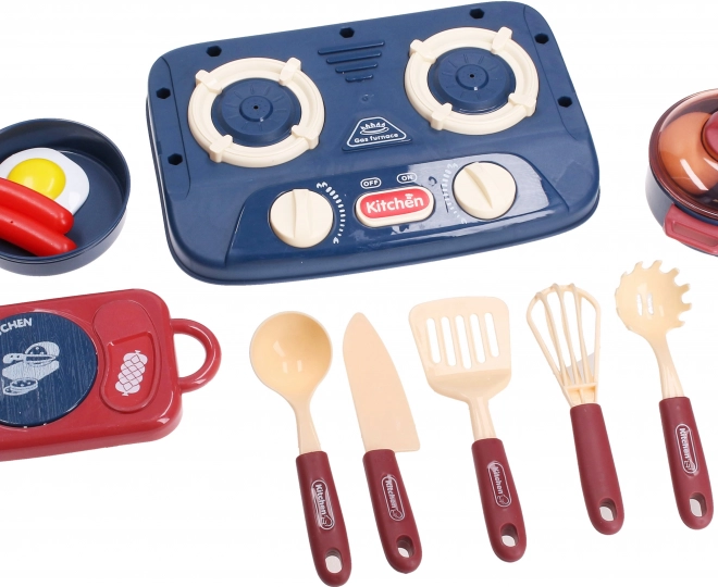 Ensemble de cuisine avec cuisinière, vaisselle et aliments