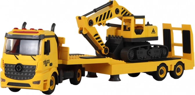Camion de remorquage avec excavatrice prêt à l’action