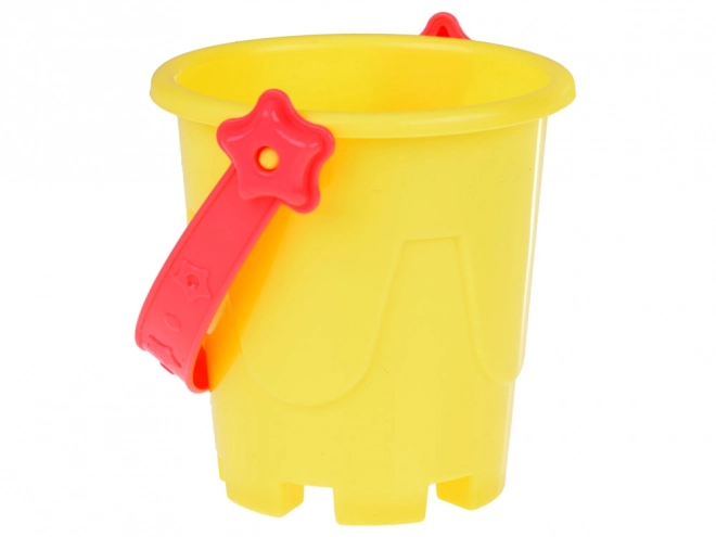 Ensemble coloré de jouets de sable avec seau et moules