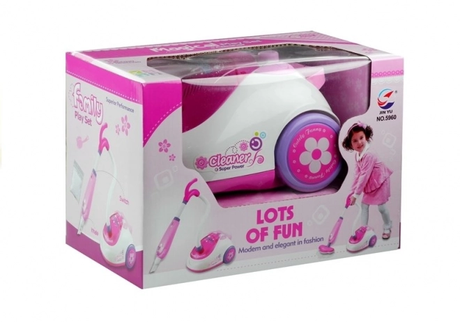 Aspirateur rose pour enfants à piles avec deux embouts
