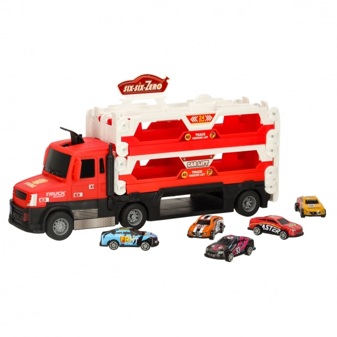 Camion rouge avec circuit caché et 6 petites voitures