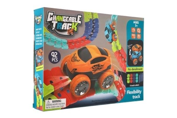 Circuit de course pour enfants avec pièces interchangeables et petite voiture lumineuse