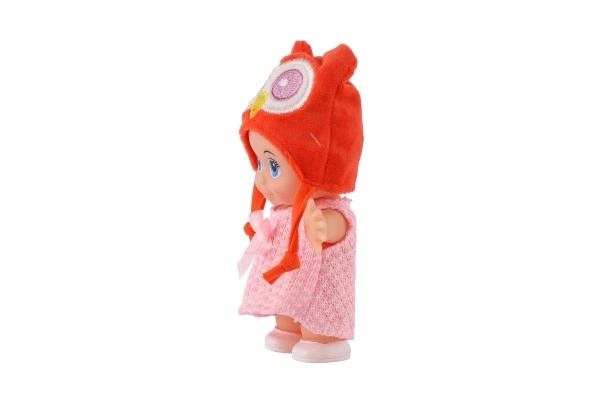 Poupée/bébé avec bonnet, plastique corps rigide 15cm, 4 types dans boîte 9x16x6cm