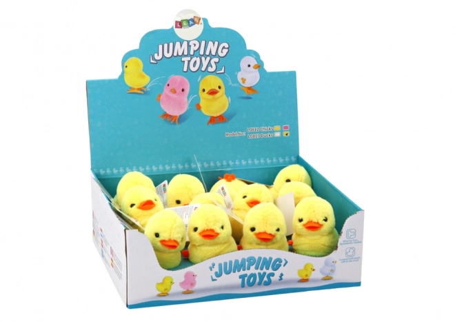 Poussin peluche jaune à remontage sautillant