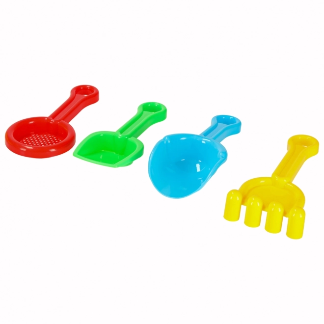 Lit d'enfant avec des jouets pour le sable et un pistolet à eau