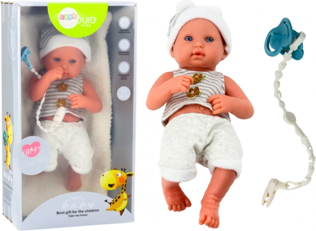 Poupée bébé réaliste en tenue blanc‑gris avec attache‑tétine et couverture
