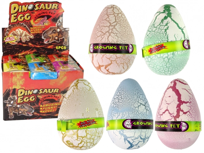 Œuf de dinosaure en croissance 12 cm