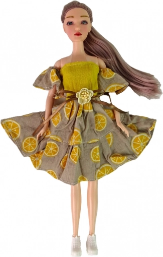 Poupée stylée avec robe à motifs d’agrumes