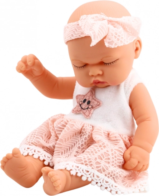 Poupée bébé endormie en robe rose avec dentelle et bandeau étoilé