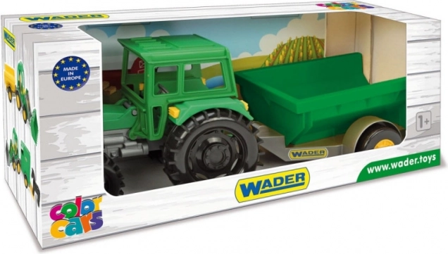 Tracteur de ferme avec remorque dans une boîte en carton