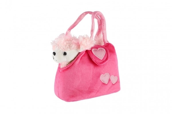 Caniche en peluche rose dans un sac à main