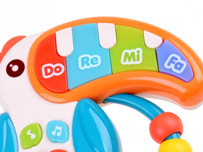 Jouet musical interactif toucan