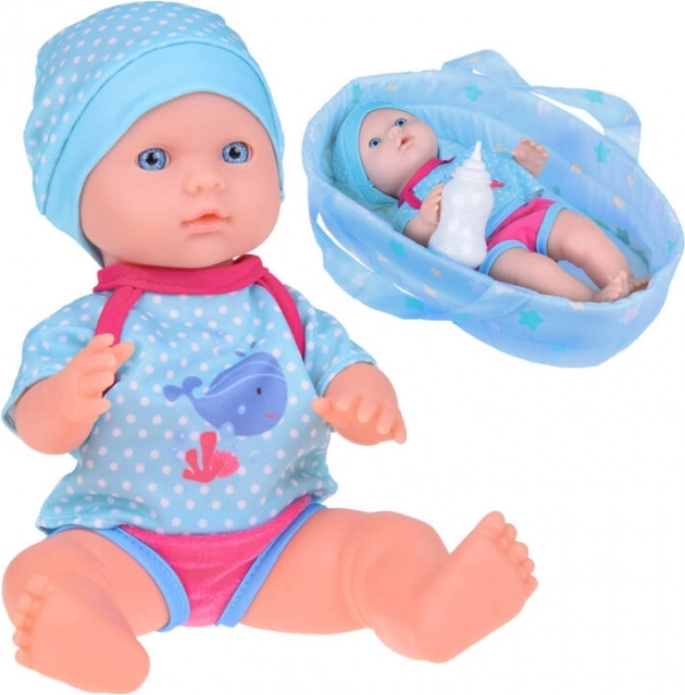 Poupée dans un porte-bébé YaYa Baby boit et fait pipi