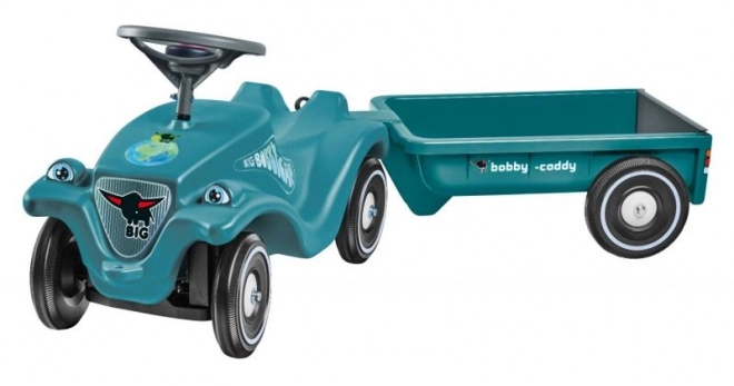 Voiture à pousser avec remorque en turquoise