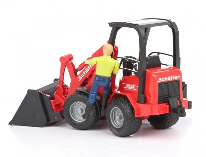 Chargeur rouge Bruder Schäffer 2034 avec figurine et accessoires