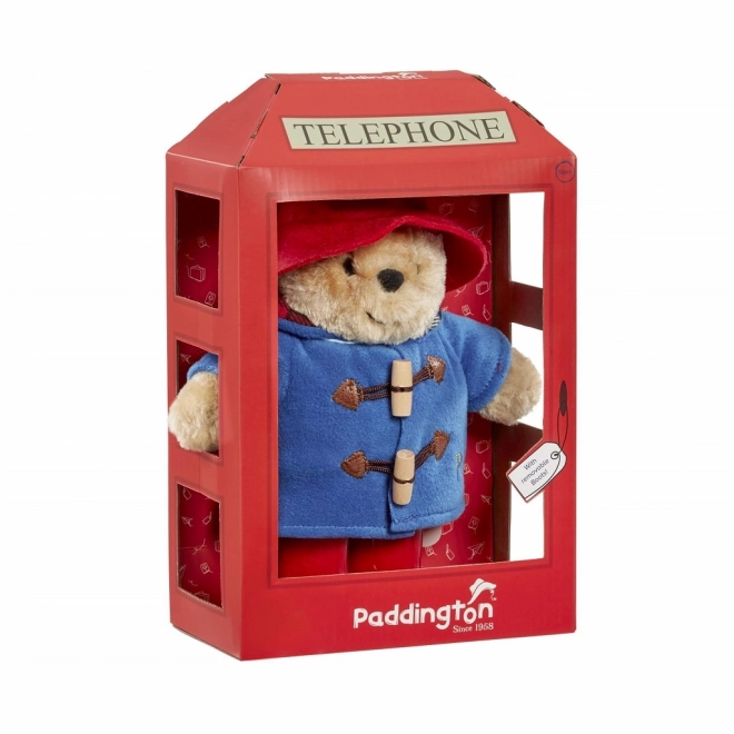 Ours en peluche Paddington arc-en-ciel dans une cabine téléphonique