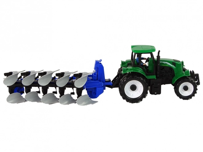 Tracteur agricole vert avec charrue