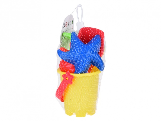 Ensemble coloré de jouets de sable avec seau et moules