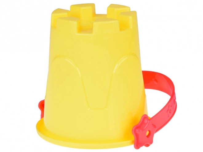 Ensemble coloré de jouets de sable avec seau et moules