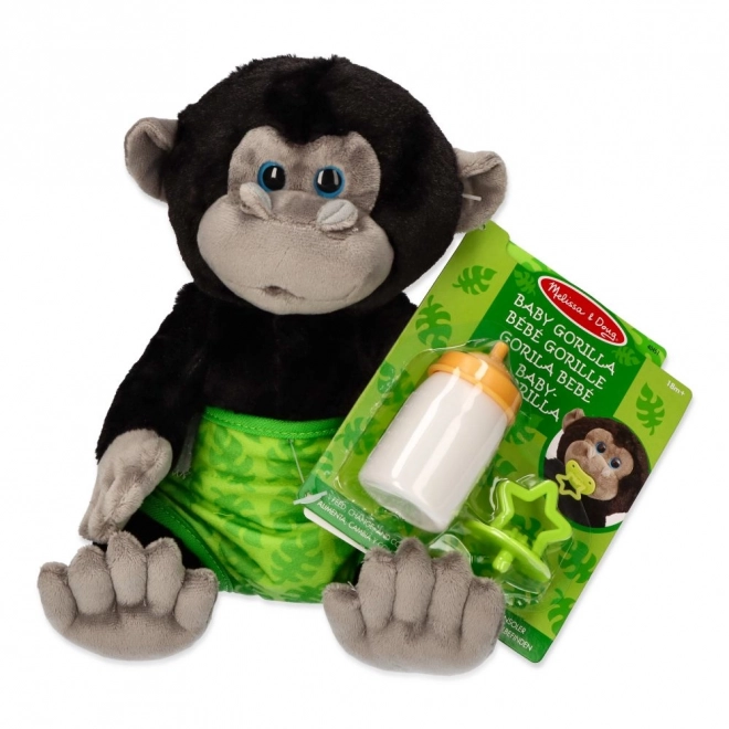 Nourrir le bébé gorille en peluche