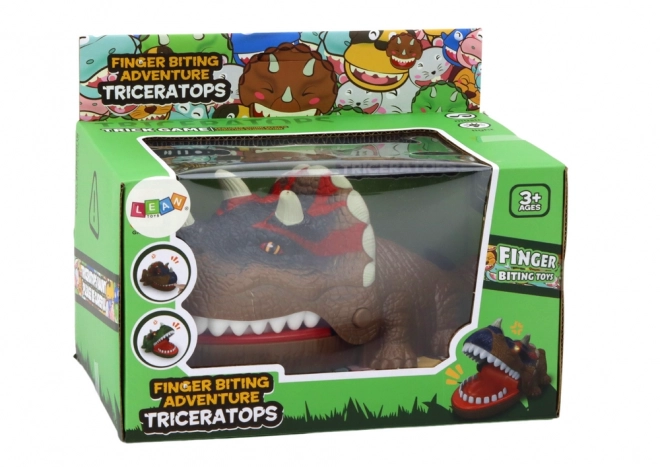 Dinosaure tricératops mordant