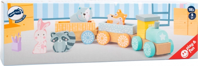 Petit train en bois aux couleurs pastel