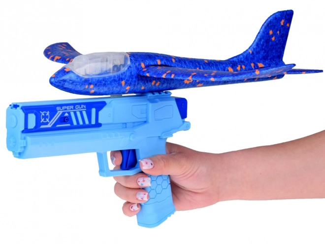 Avion en mousse amusant avec lumières LED lancé depuis un pistolet