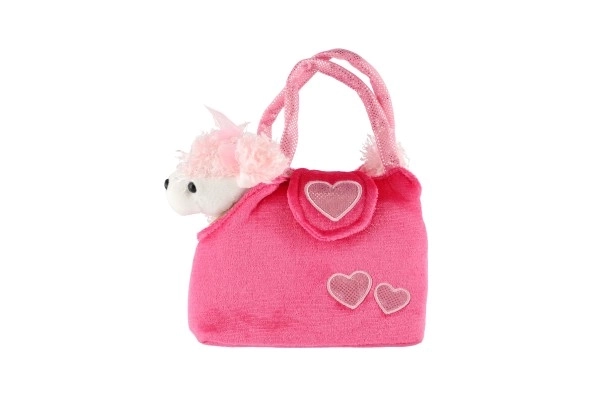 Caniche en peluche rose dans un sac à main