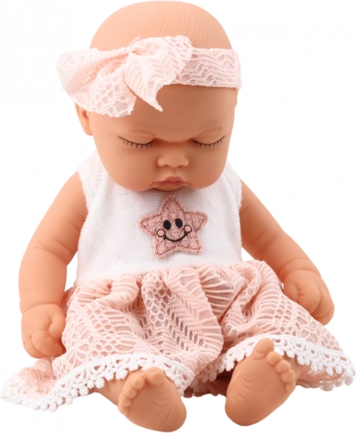 Poupée bébé endormie en robe rose avec dentelle et bandeau étoilé